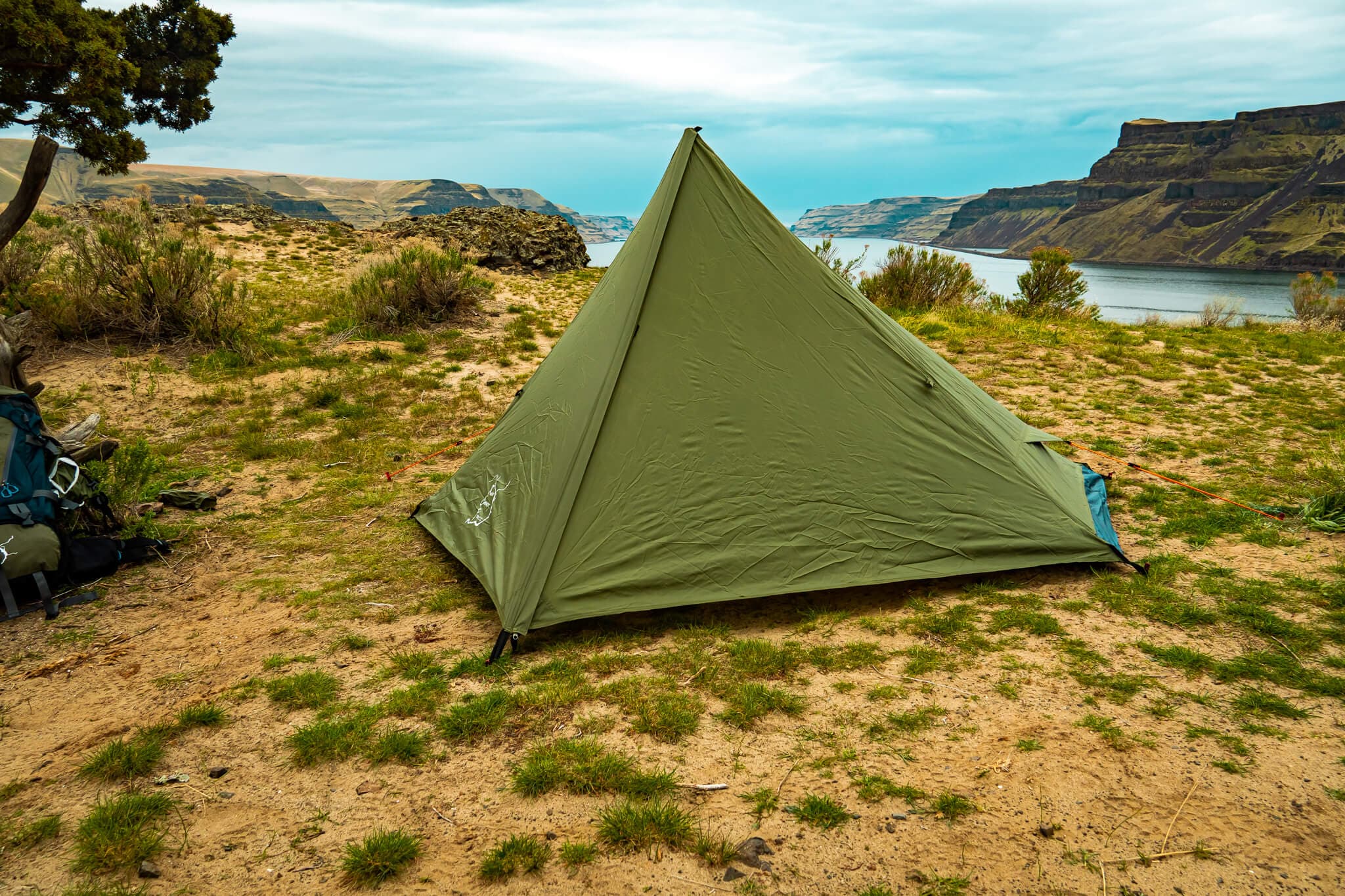 River Country Products Trekker Tent pitched with trekking poles in open country